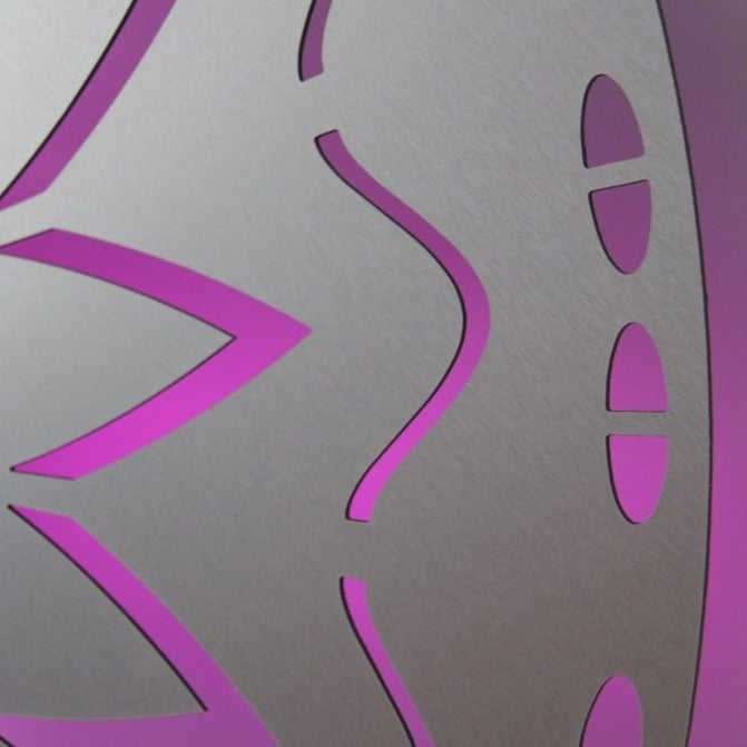 Close-up of the KuvaLight New Beginning in brushed aluminum with a pink color light.