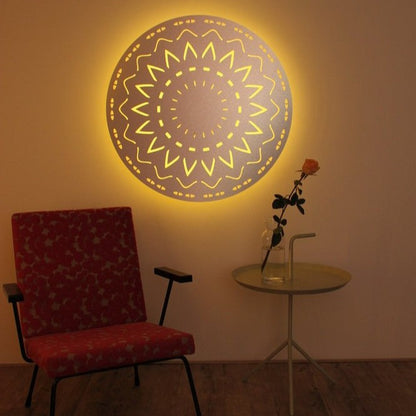 KuvaLight New Beginning in brushed aluminum (80cm) in a home evening setting with a yellow color light which creates a warm atmosphere.