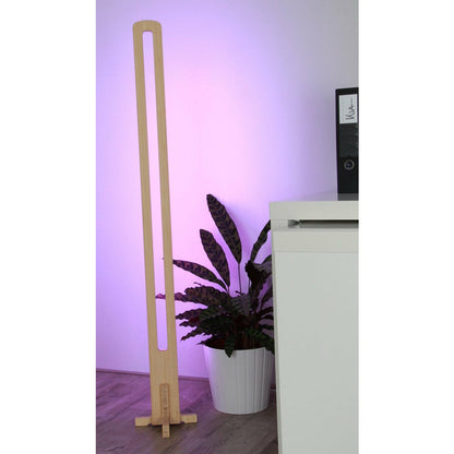 KuvaLight Parallel in Bamboo with a purple light standing next to a desk.